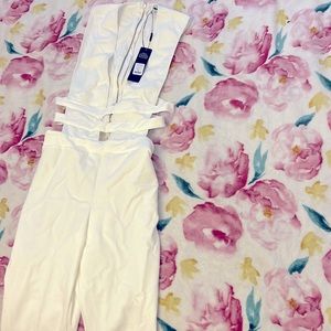 A nice white Jumpsuit sexy open leverage size medium